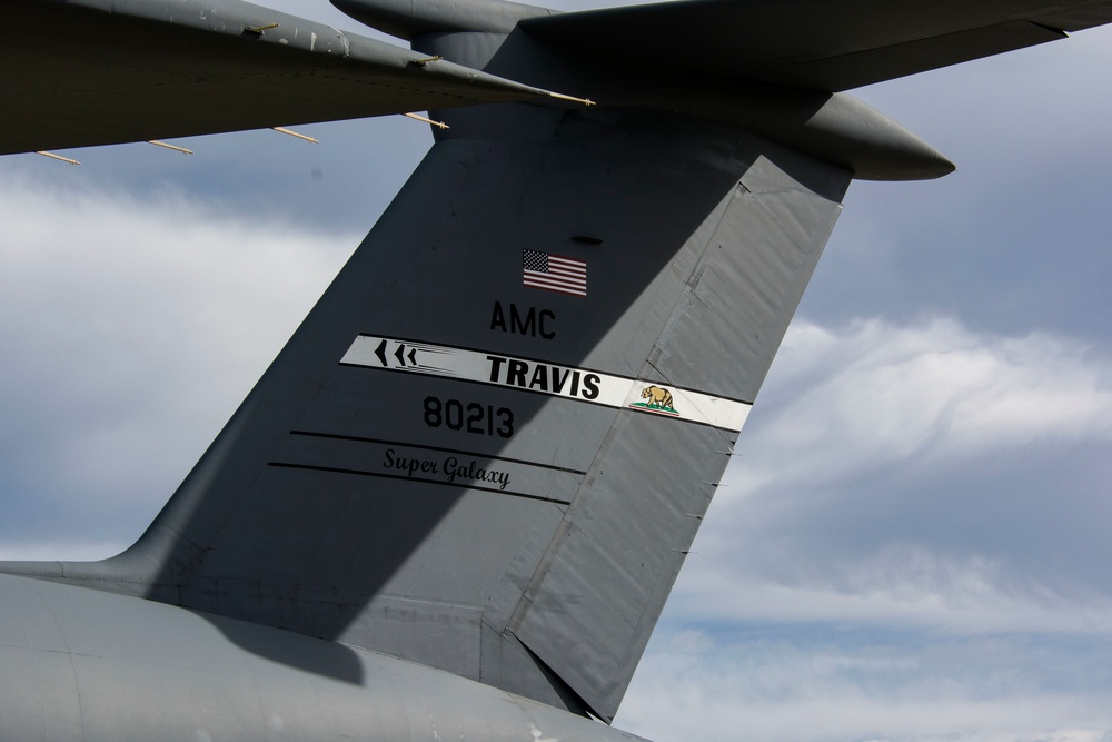 C-5M scoops up in-flight data for NASA