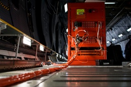 C-5M scoops up in-flight data for NASA