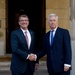 Secretary of defense is greeted by Secretary of State for Defense Michael Fallon at Lancaster House