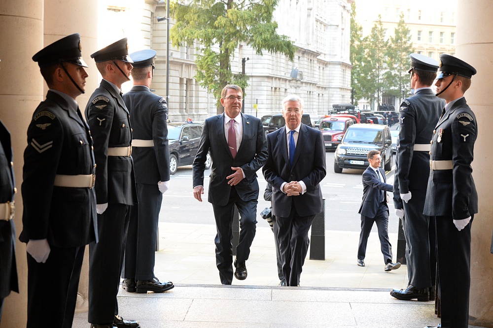 Secretary of defense is greeted by Secretary of State for Defense Michael Fallon at the Ministry of Defense