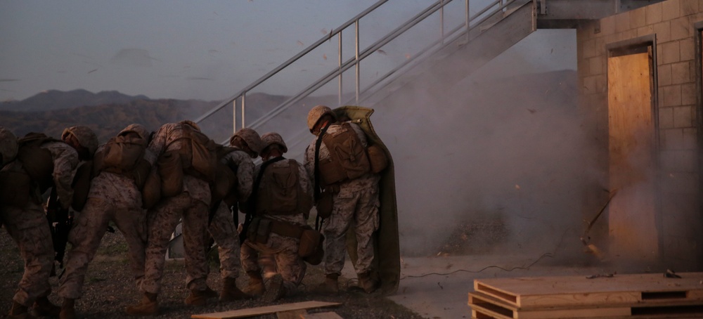 Marines blow the door off its hinges