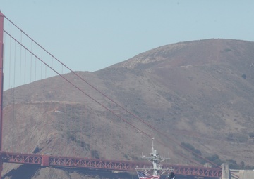Parade of ships sail through San Francisco Bay