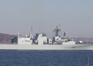Parade of ships sail through San Francisco Bay