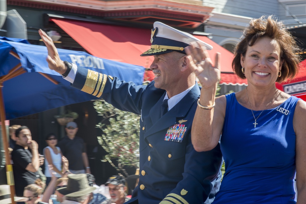 Coast Guard Vice Adm. Charles Ray waves to the crowd during during the Italian Heritage Parade