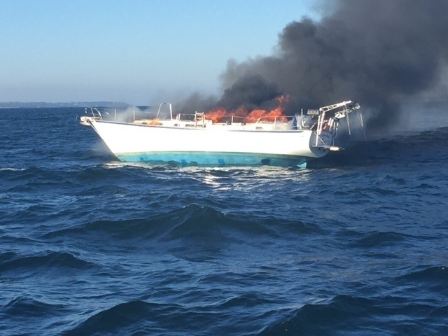 Coast Guard rescues 2 from burning sailboat