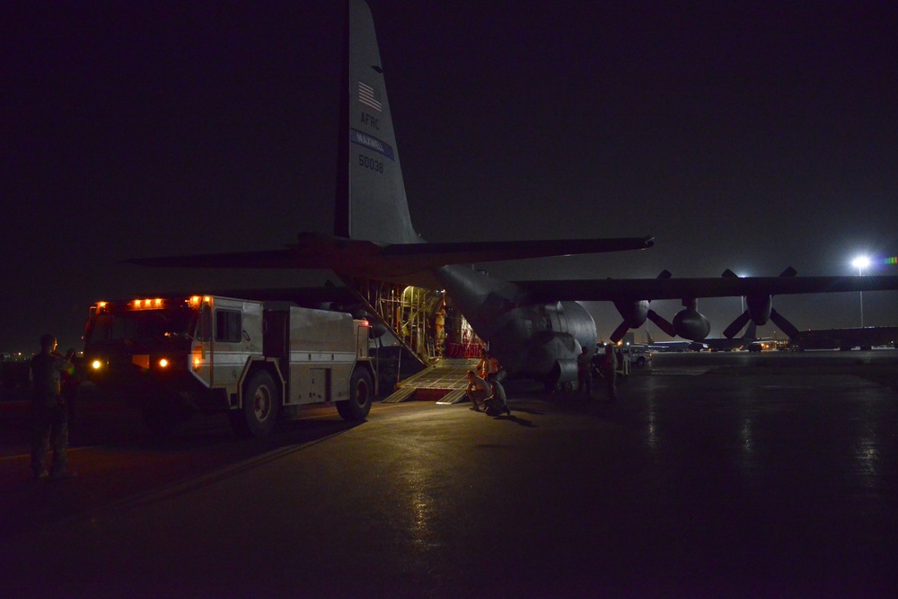 ‘Mad Mules’ and ‘Mighty Ocho’ load P-19 ARFF vehicle onto ‘Herk’ to support OIR