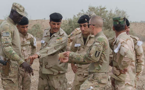 US Soldiers provide Iraqi soldiers bulldozer training to build defenses, clear obstacles