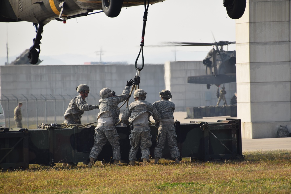Air Defenders sling load training canister in Korea
