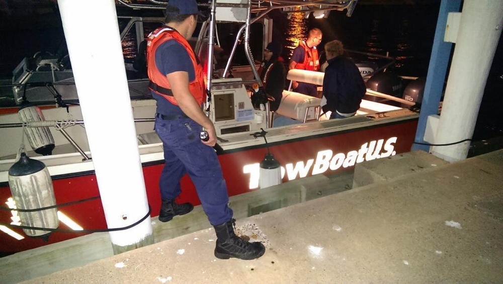 Coast Guard tows boat and crew back to shore