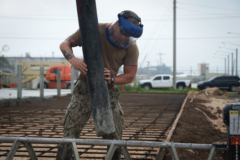 NMCB 1 Seabees place concrete at project in Naval Base Guam