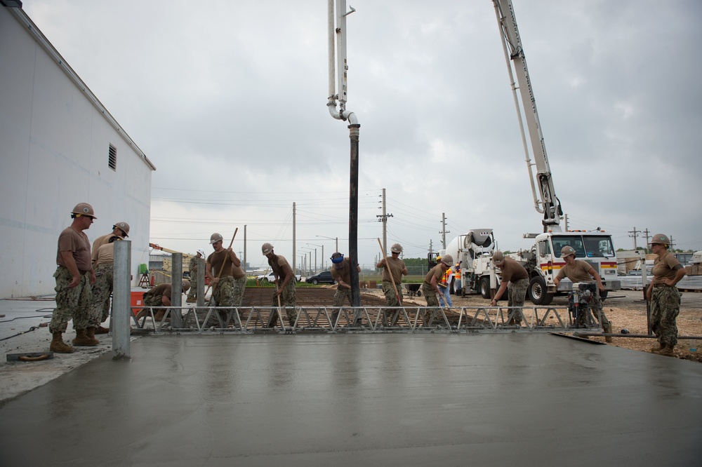 NMCB 1 Seabees place concrete at project in Naval Base Guam