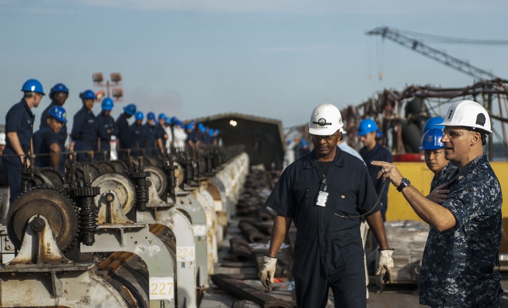 Catapult cylinder install on USS Lincoln flight deck