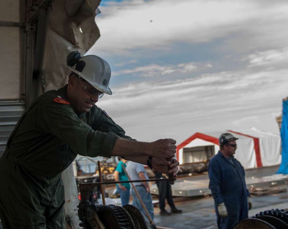 Catapult cylinder install on USS Lincoln flight deck