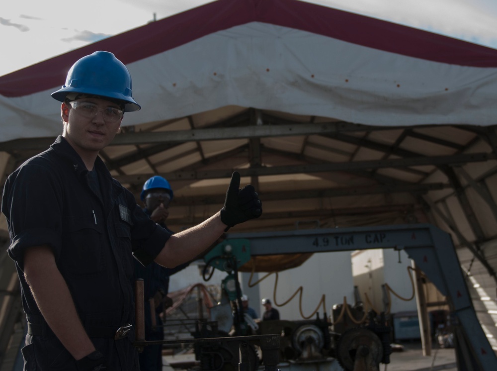 Catapult cylinder install on USS Lincoln flight deck