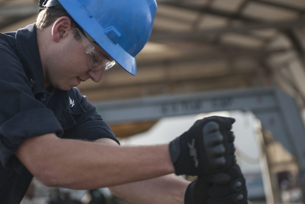 Catapult cylinder install on USS Lincoln flight deck