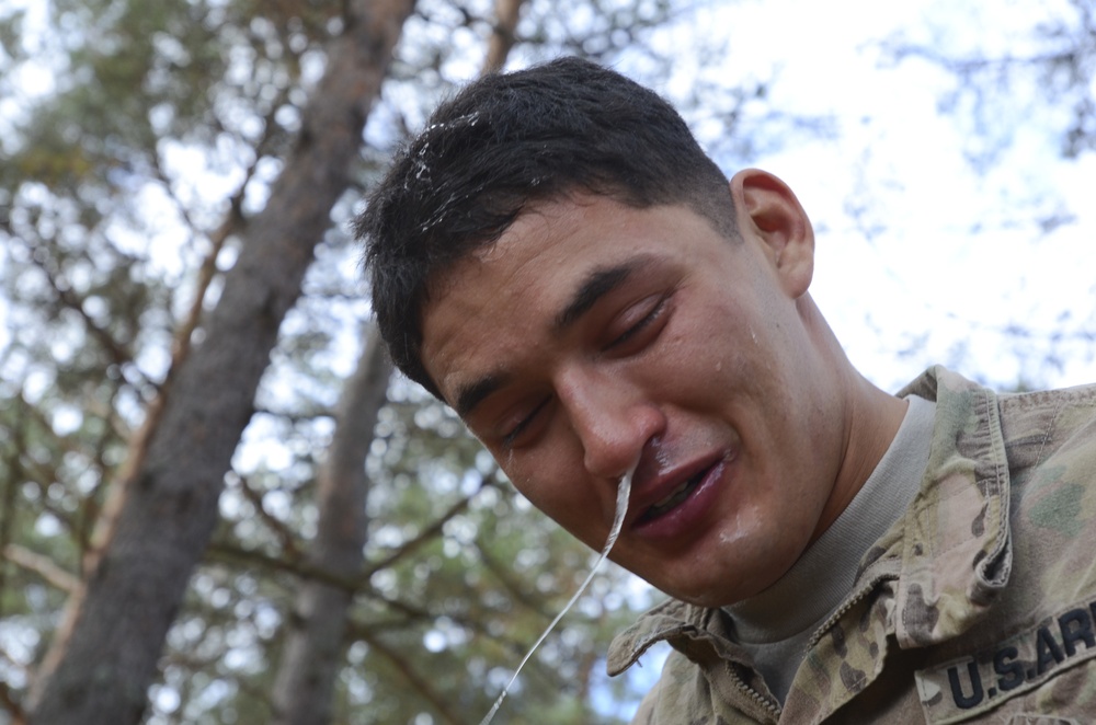 Latvian, U.S. Soldiers don their masks