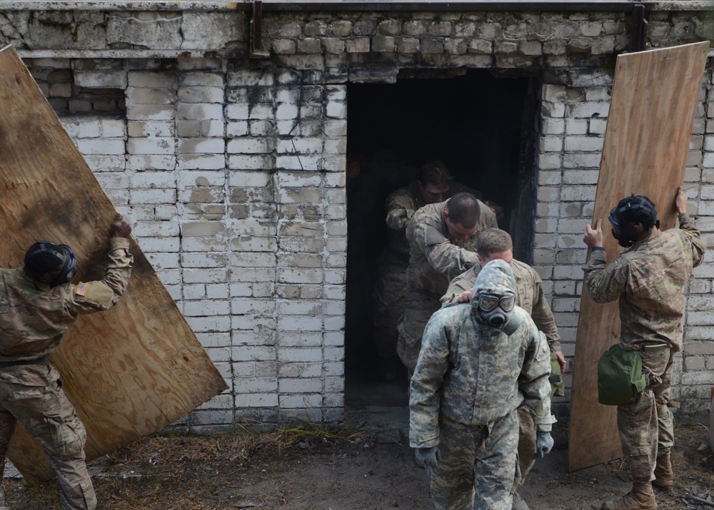 Latvian, US Soldiers don their masks