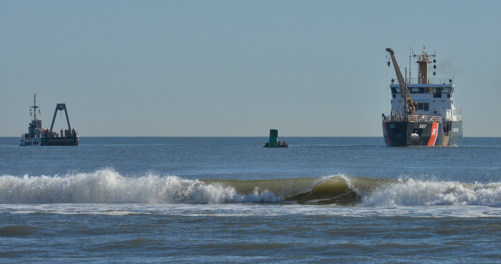 Coast Guard, Navy refloat buoy