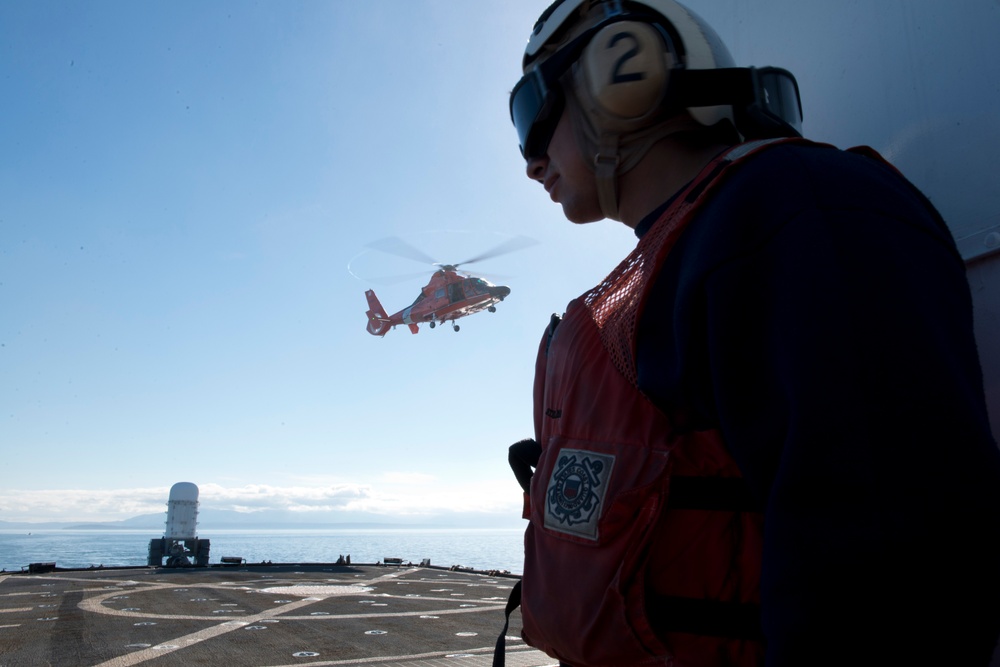 MH-65 Dolphin helicopter trains with USCGC Midgett