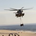 Marines with the 26th MEU perform lift at sunset on the beach