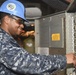 Nimitz Sailor operates elevator control panel