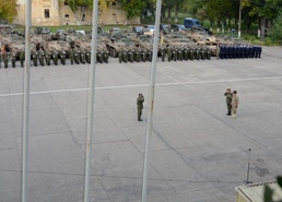 US, Romanian Soldiers stand shoulder to shoulder