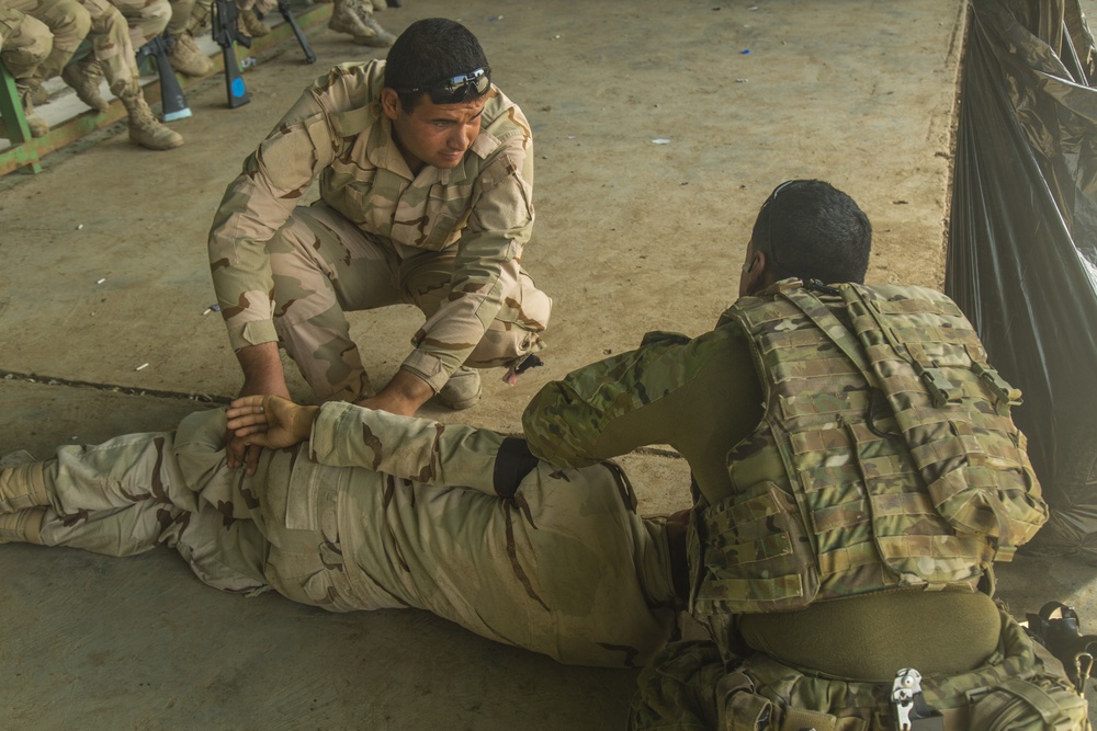 Iraqi soldiers receive chemical warfare, first-aid training at Camp Taji