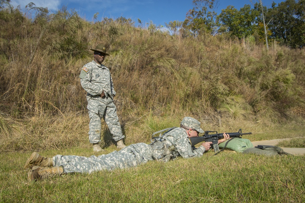 Drill sergeant observes firing