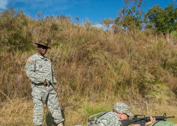 Drill sergeant observes firing