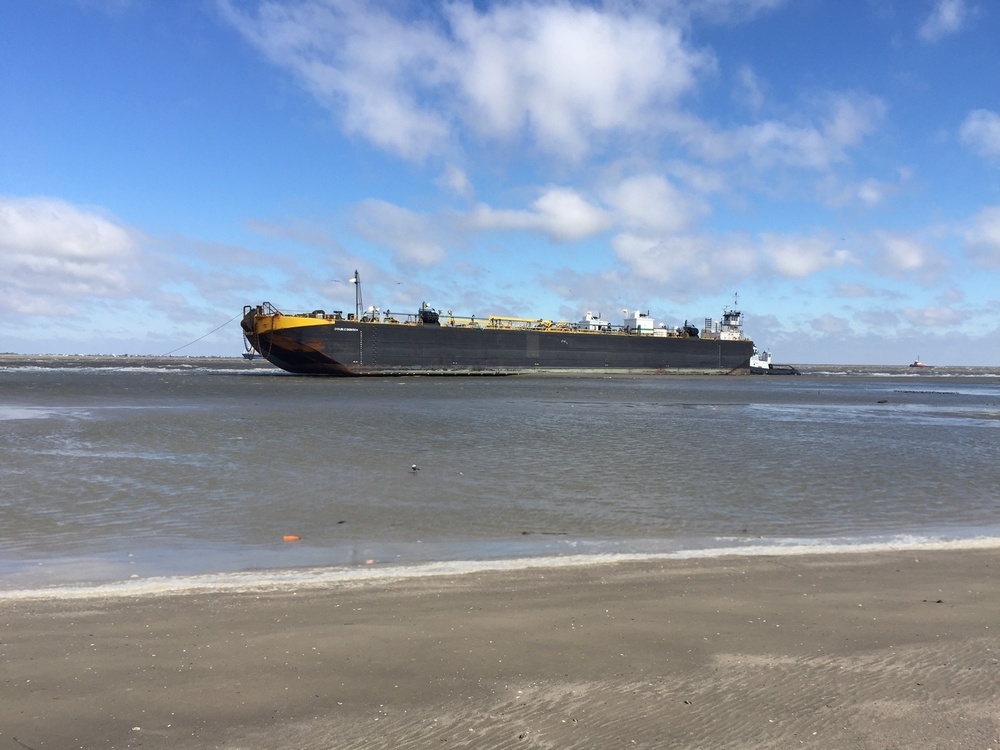 Coast Guard oversees work to remove grounded tug, tank barge on Galveston Island, Texas