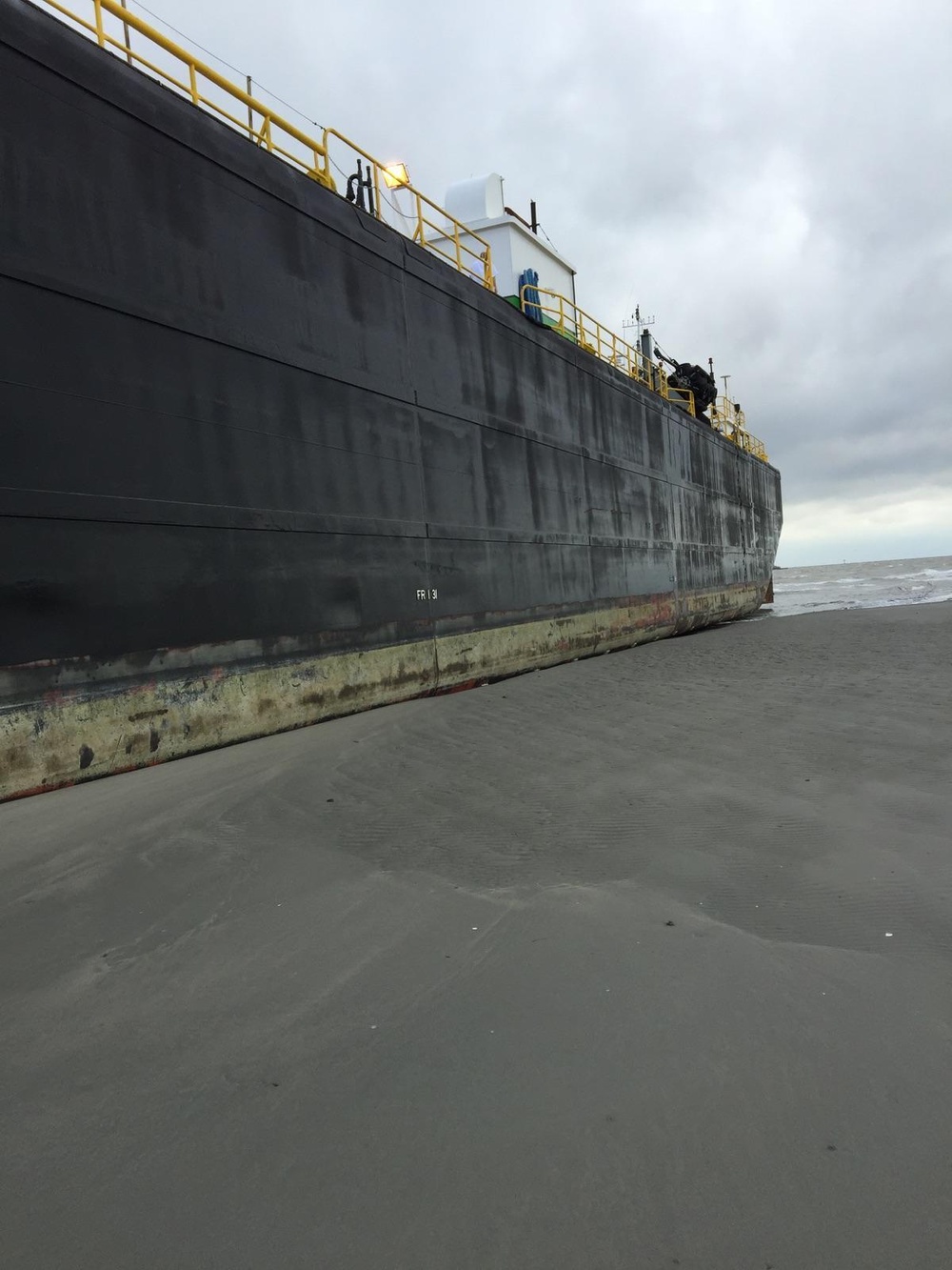 Coast Guard oversees work to remove grounded tug, tank barge on Galveston Island, Texas