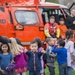 A student gives two thumbs up for the Coast Guard