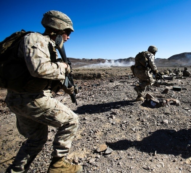 Marines with Alpha Company, 1/8 fire away during company attack