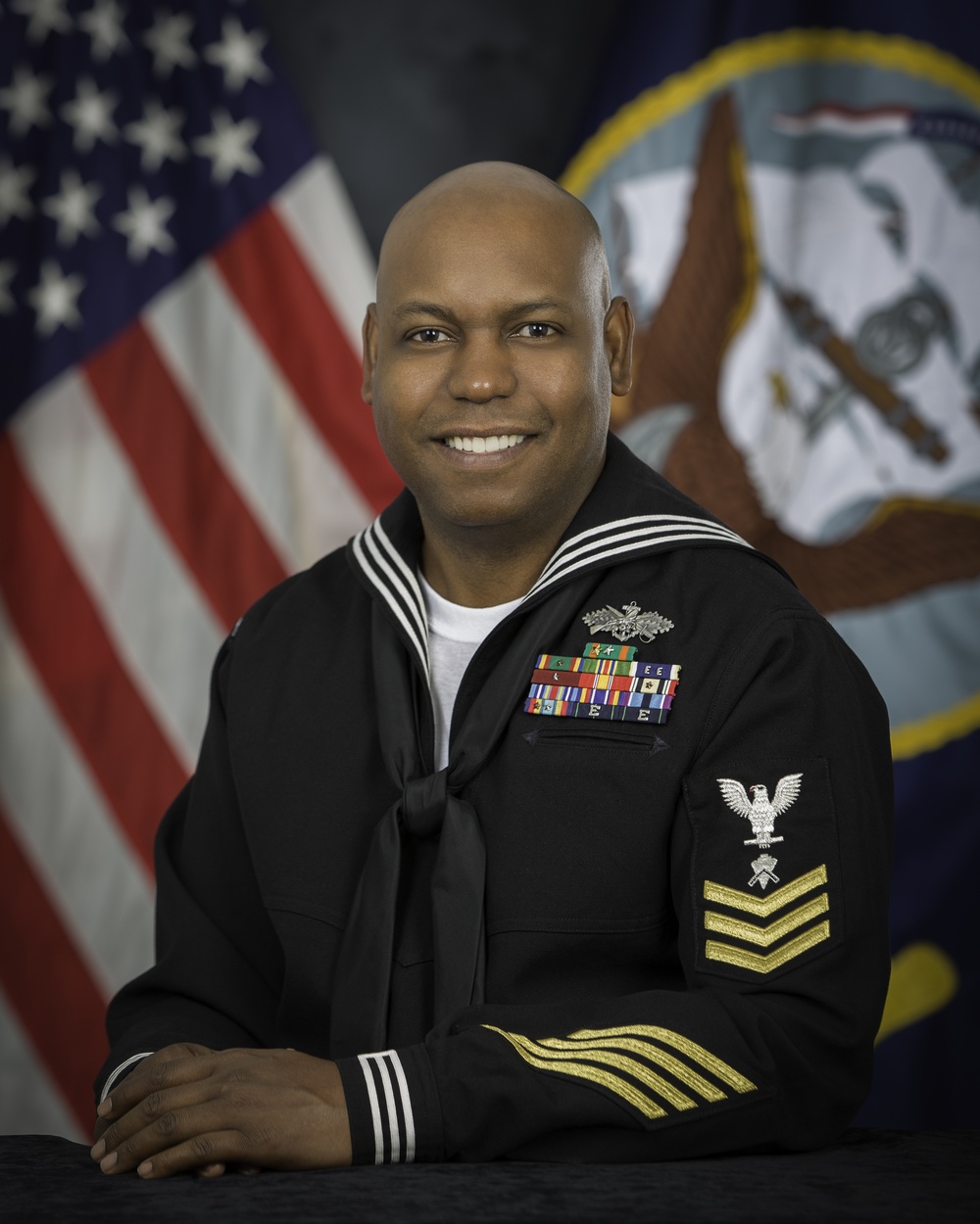 Official portrait, Builder 1st Class (Seabee Combat Warfare) Kentys A. Miller, US Navy