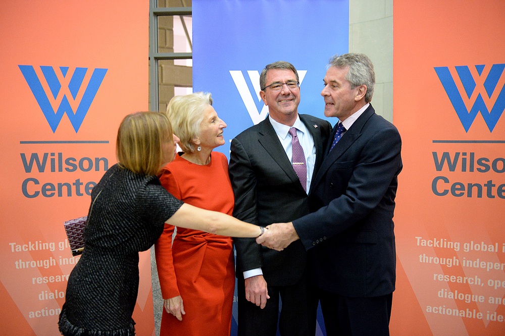 Secretary of defense takes photos with guests before receiving the Woodrow Wilson Award for Public Service