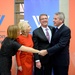 Secretary of defense takes photos with guests before receiving the Woodrow Wilson Award for Public Service