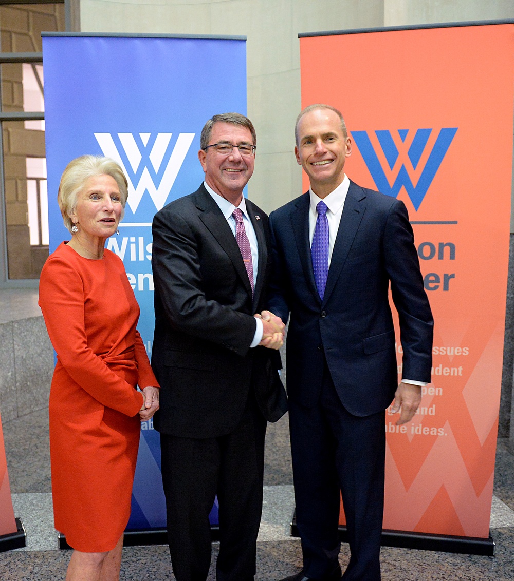 Secretary of defense takes photos with guests before receiving the Woodrow Wilson Award for Public Service