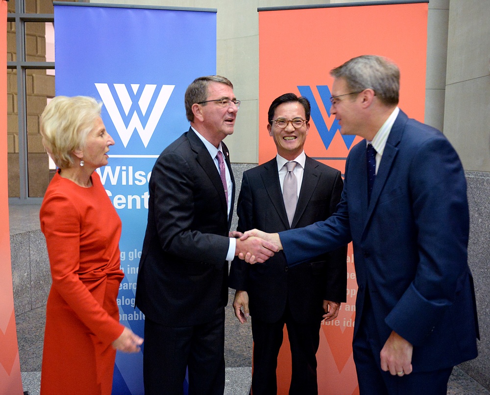 Secretary of defense takes photos with guests before receiving Woodrow Wilson Award for Public Service