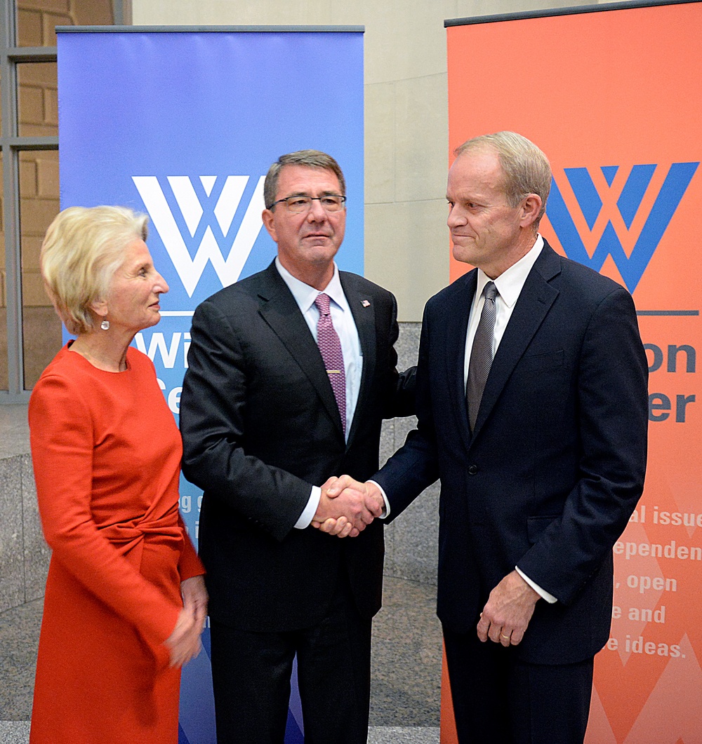 Secretary of defense takes photos with guests before receiving the Woodrow Wilson Award for Public Service