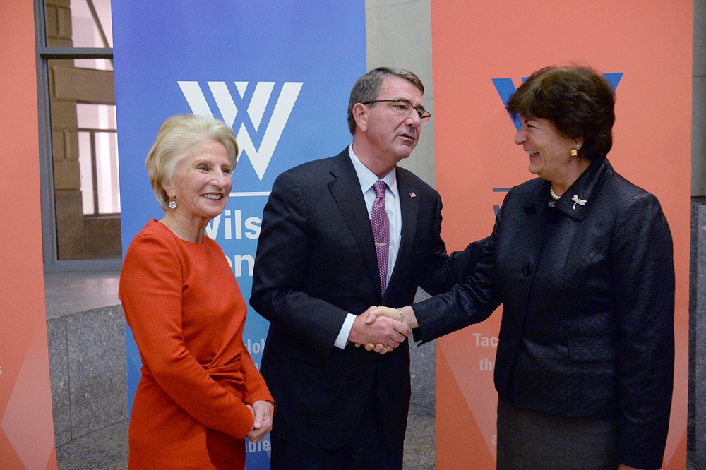 Secretary of defense takes photos with guests before receiving the Woodrow Wilson Award for Public Service