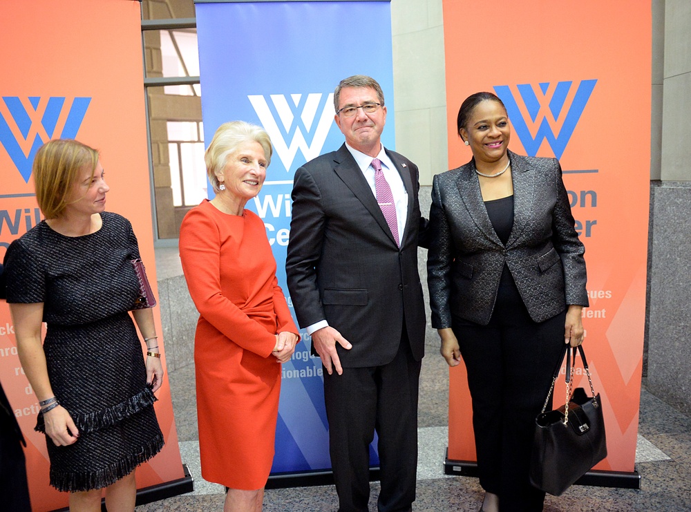 Secretary of defense takes photos with guests before receiving the Woodrow Wilson Award for Public Service