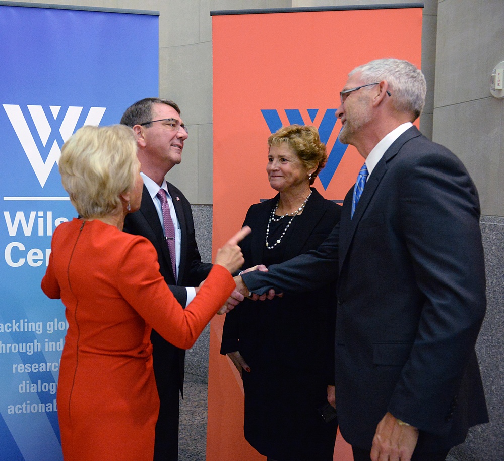 Secretary of defense takes photos with guests before receiving the Woodrow Wilson Award for Public Service