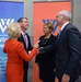 Secretary of defense takes photos with guests before receiving the Woodrow Wilson Award for Public Service