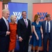 Secretary of defense takes photos with guests before receiving the Woodrow Wilson Award for Public Service