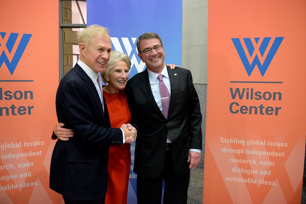 Secretary of defense takes photos with guests before receiving the Woodrow Wilson Award for Public Service