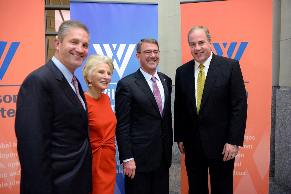 Secretary of defense takes photos with guests before receiving the Woodrow Wilson Award for Public Service