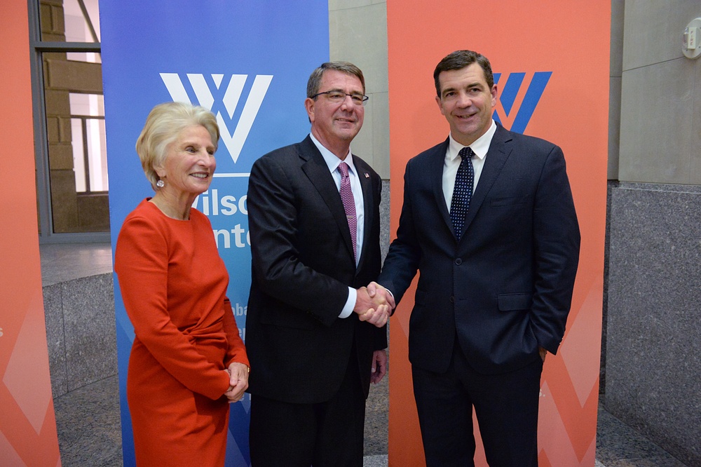 Secretary of defense takes photos with guests before receiving the Woodrow Wilson Award for Public Service