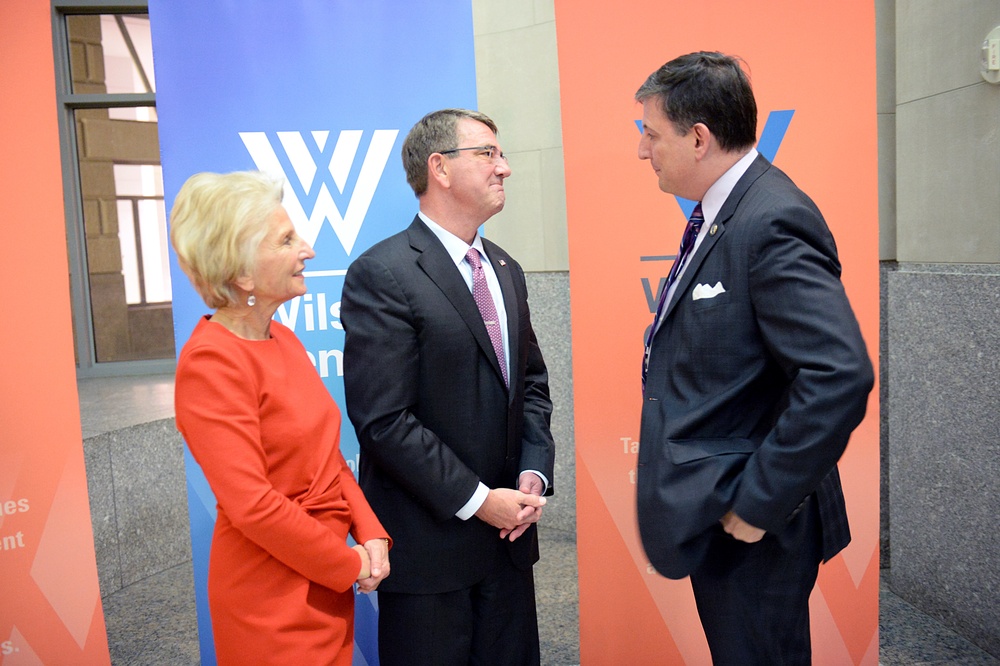 Secretary of defense takes photos with guests before receiving the Woodrow Wilson Award for Public Service