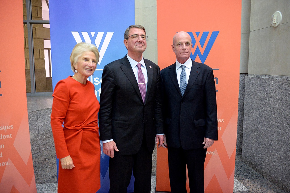 Secretary of defense takes photos with guests before receiving the Woodrow Wilson Award for Public Service