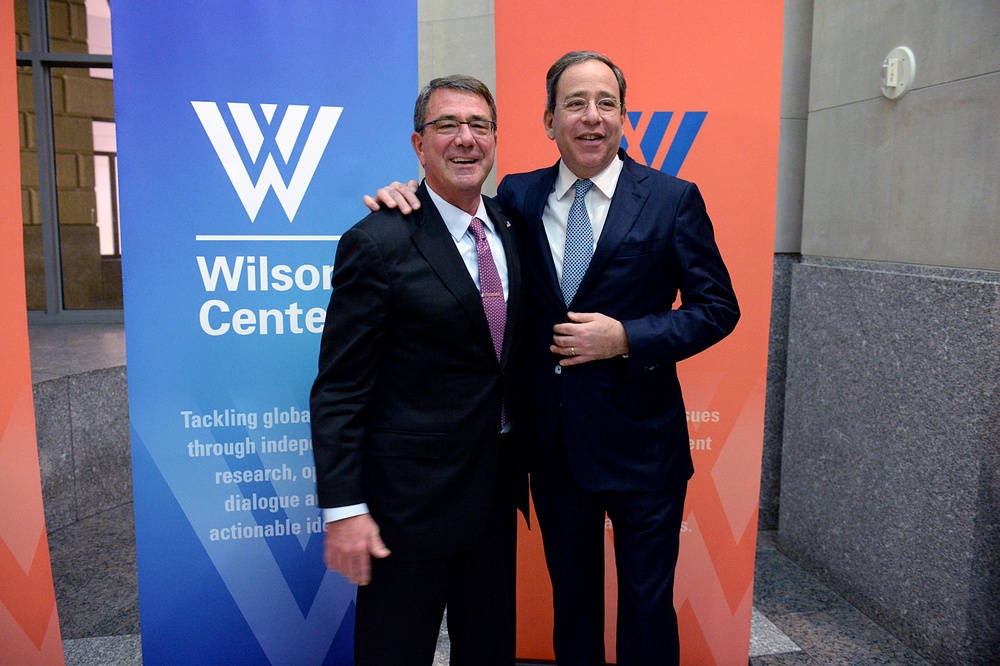 Secretary of defense takes photos with guests before receiving the Woodrow Wilson Award for Public Service